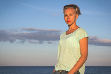 Fototapeta premium Portrait of beautiful blonde woman on the summer beach