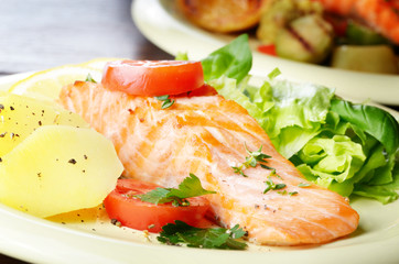 Fried salmon fillet with vegetables