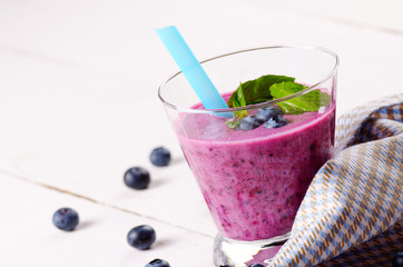 Blueberry shake on white table