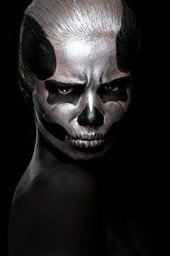 Woman in day of the dead mask skull face art. Halloween face art