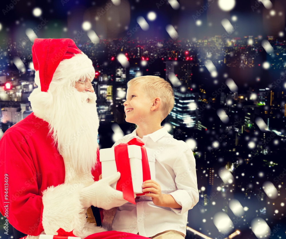 Canvas Prints smiling little boy with santa claus and gifts