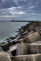 Concrete blocks form the jetty of the harbor of Scheveningen in the Netherlands