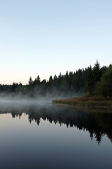 beautiful lake with mist early in the morning