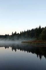 Fototapeta na wymiar beautiful lake with mist early in the morning