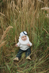 happy little girl in high grass