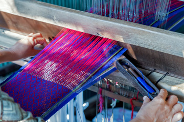 weaves with an old loom handcraft rug