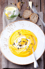Pumpkin soup with cream, seeds and thyme 