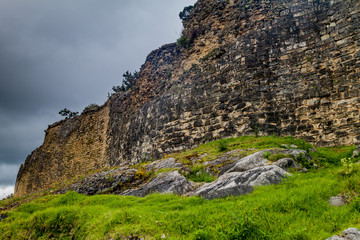 Fototapeta premium Stone wall of Kuelap, ruined citadel city of Chachapoyas cloud forest culture in mountains of northern Peru.
