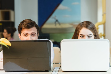 happy young relaxed couple working on laptop computer
