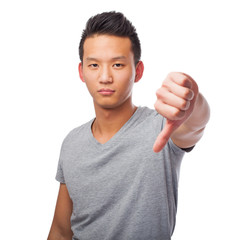 portrait of an asian man doing a negative gesture