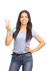 Young woman making a peace sign