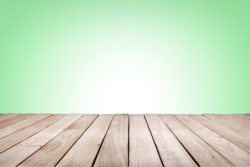 Wooden platform with green background.