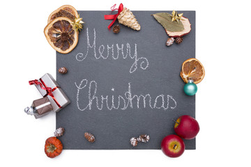 A plate of slate with Merry Christmas on it