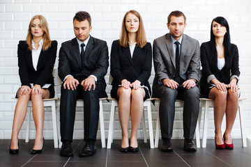 Stressed business people wiating for job interview - obrazy, fototapety, plakaty