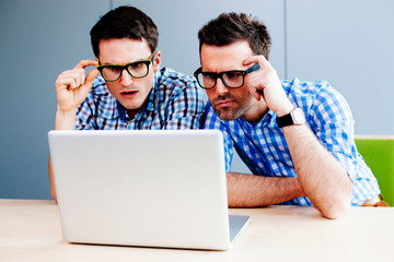 Two webdesigners looking at a website