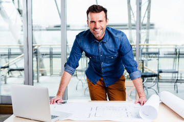 Successful architect and his design on paper