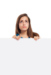 young woman thinking holding a white board on white