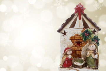 Nativity Scene / Photography of a Christmas nativity scene with the Virgin Mary, St. Joseph and baby Jesus on a golden bokeh background. Stock photography.