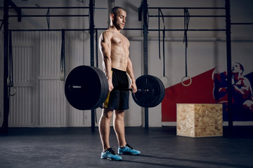 Young man during deadlift workout