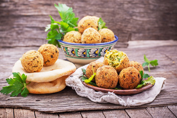 fresh falafel balls served on a wooden board