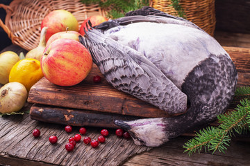 Wild goose duck hunted in the hunting season on old wooden background