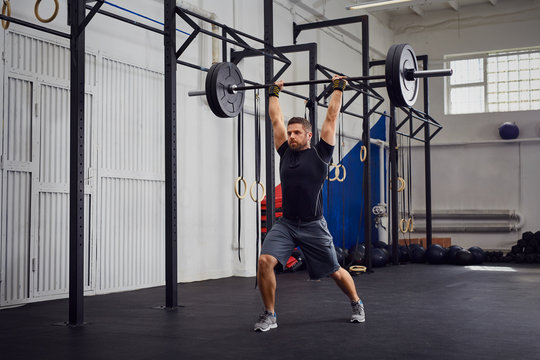 Lunges With Barbells Over Head