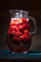 strawberries in a jug