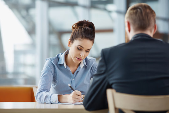 Businessman and businesswoman during job interview