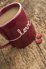 coffee in a red mug on wooden table for love