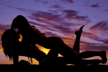 silhouette of two women in the sunset