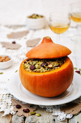 pumpkin stuffed with millet, spinach, dried cranberries, mushroo