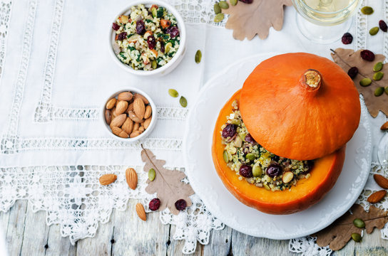 pumpkin stuffed with millet, spinach, dried cranberries, mushroo