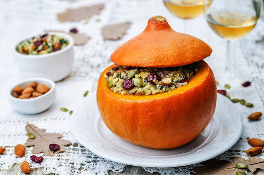 pumpkin stuffed with millet, spinach, dried cranberries, mushroo