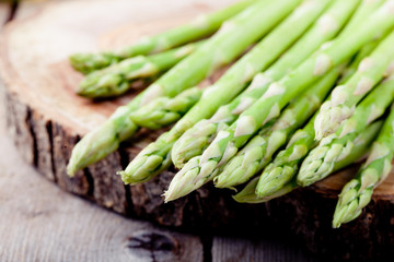 Fresh asparagus on a wooden background