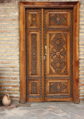 wooden decorated door with elegant carving