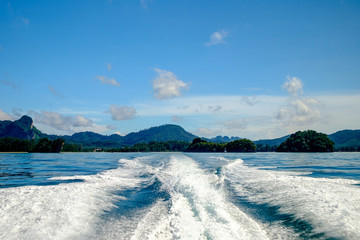 seascapes and waves behind speedboat