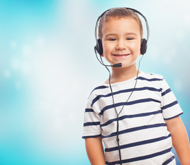 portrait of a little boy using a headset