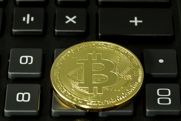 bitcoin with black calculator