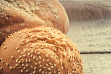 Freshly baked bread and bun on a table