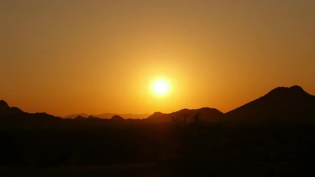 Peaceful sunrise in the desert. 4K UHD time lapse