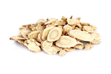 Chinese Herbal medicine - Astragalus slices, Huang Qi (Astragalus propinquus) on white background...