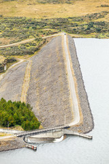 Explore the synergy of human engineering and ecological beauty at the man made dam nestled within...
