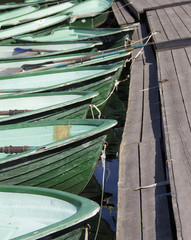 colorful boats in the park tied to a pier at moorings