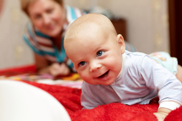 Happy baby with grandmother