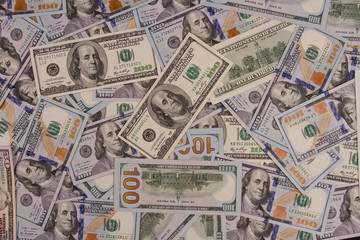 Fototapeta na wymiar One hundred US dollars. Many banknotes. Benjamin Franklin, Independence Hall.