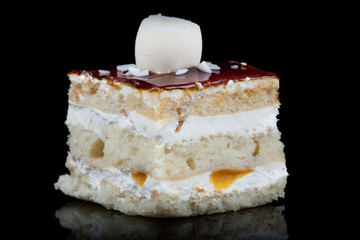 Indulge in the exquisite delight of a mouthwatering caramel cake,captured in a captivating black studio shot.