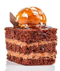 A decadent caramel cocoa cake on a white background, drizzled with rich caramel sauce and sprinkled with cocoa powder.
