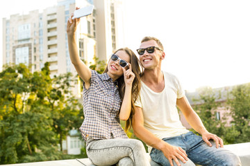Fototapeta premium Girl and boy are outdoors at roof