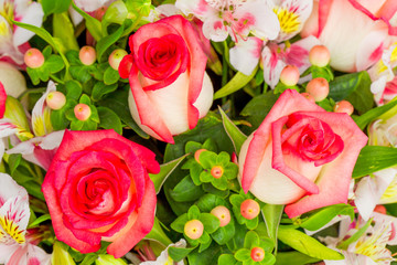 Stunning flower arrangement featuring three large roses,crafted with exquisite precision and artistry.