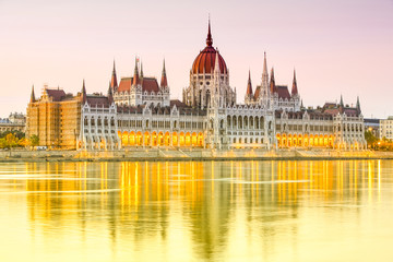 Fototapeta na wymiar Experience the breathtaking beauty of the Hungarian Parliament Building at sunset in Budapest,Hungary,a must visit landmark for its stunning architecture and historical significance.